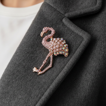 Close-up of flamingo brooch on coat