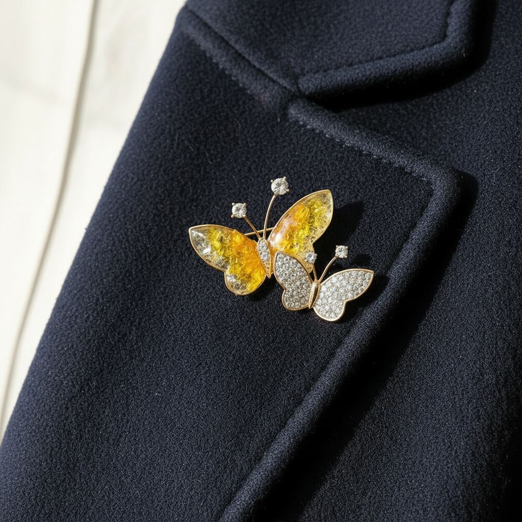Double butterfly brooch on clean coat
