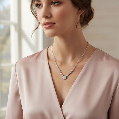 Lifestyle image of woman in pink blouse wearing crystal necklace