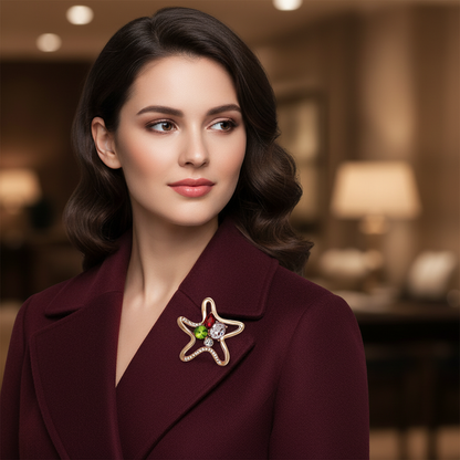 Lifestyle image of woman wearing starfish brooch on burgundy coat